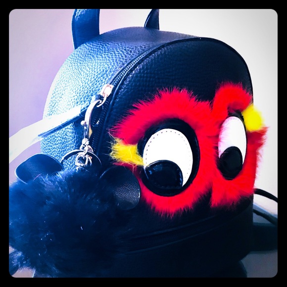Handbags - Mini Black Backpack With Eye Decoration.